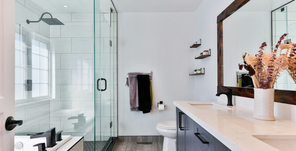 Accessible modern bathroom with grab bars and walk-in shower